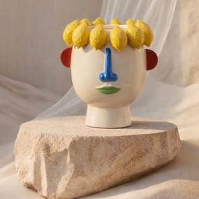 Florero con cara y frutas blanco y colores